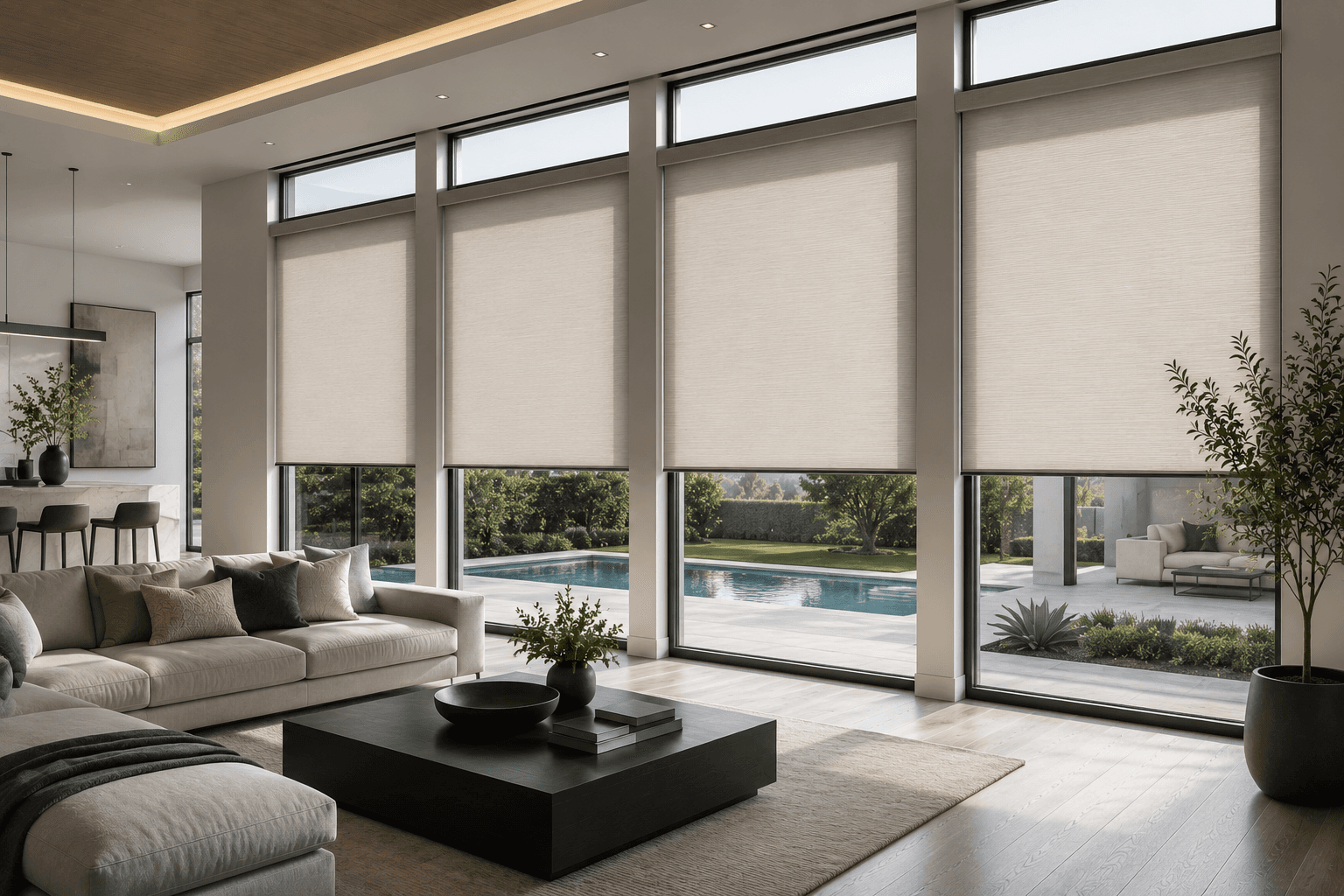 Modern living room with beige roller shades on windows overlooking a backyard swimming pool.